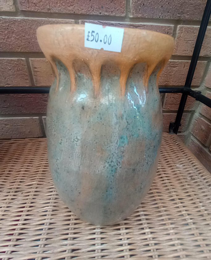 Speckled blue and ochre pot