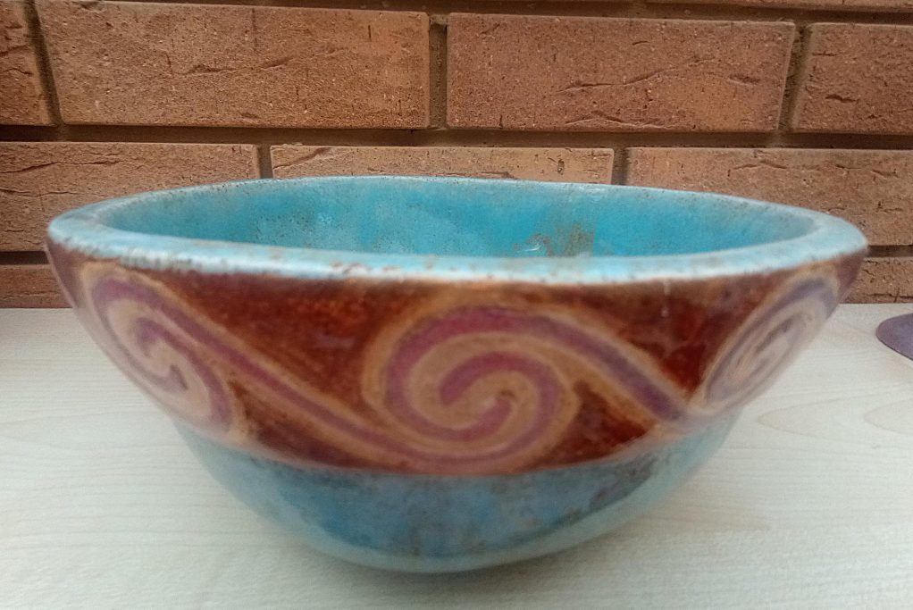 Blue bowl with warm swirl pattern